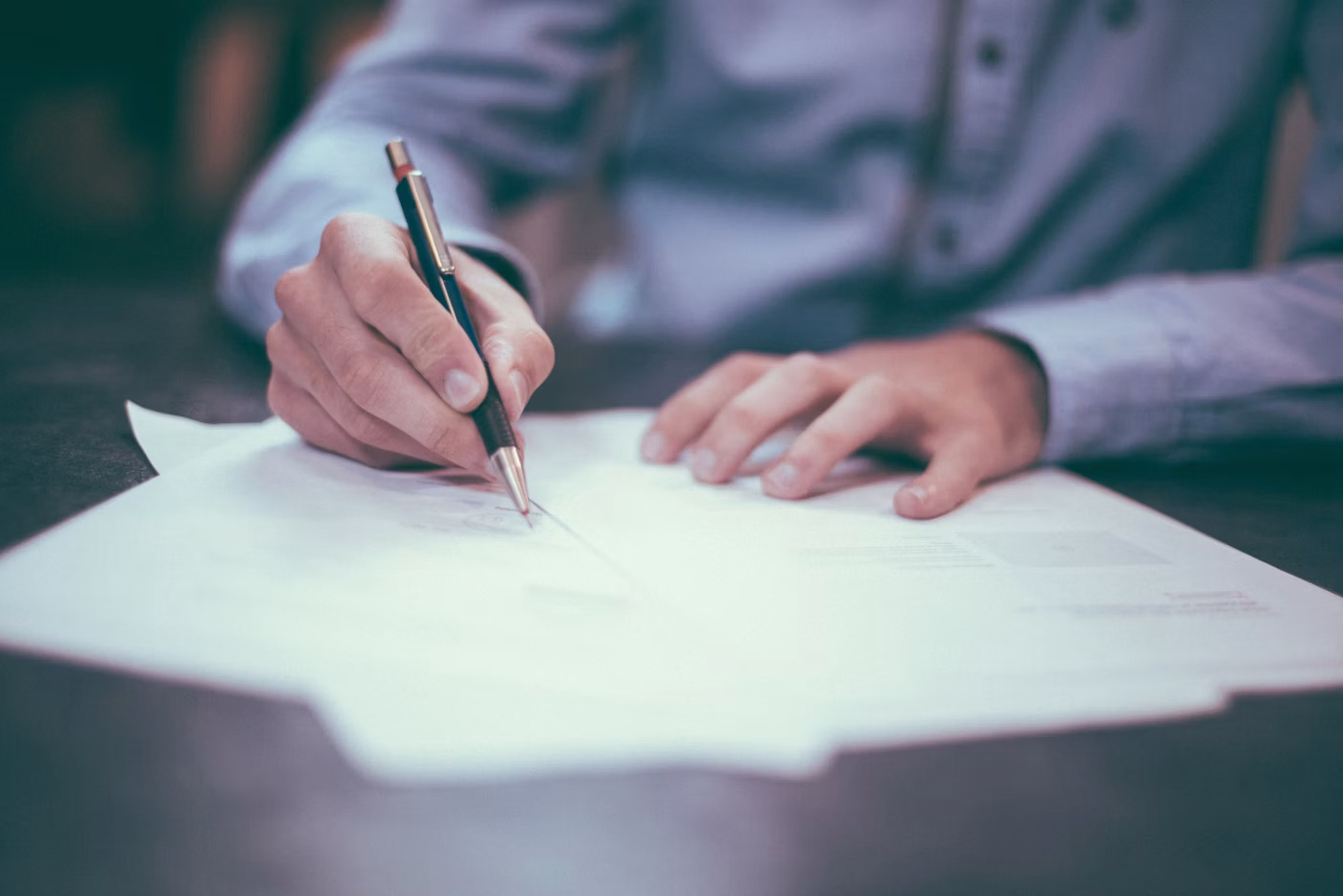 Immigration documents and planning materials on a desk